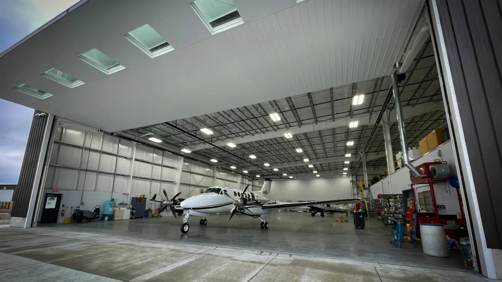 King Air business aircraft inside a private hangar between owner-operator trips