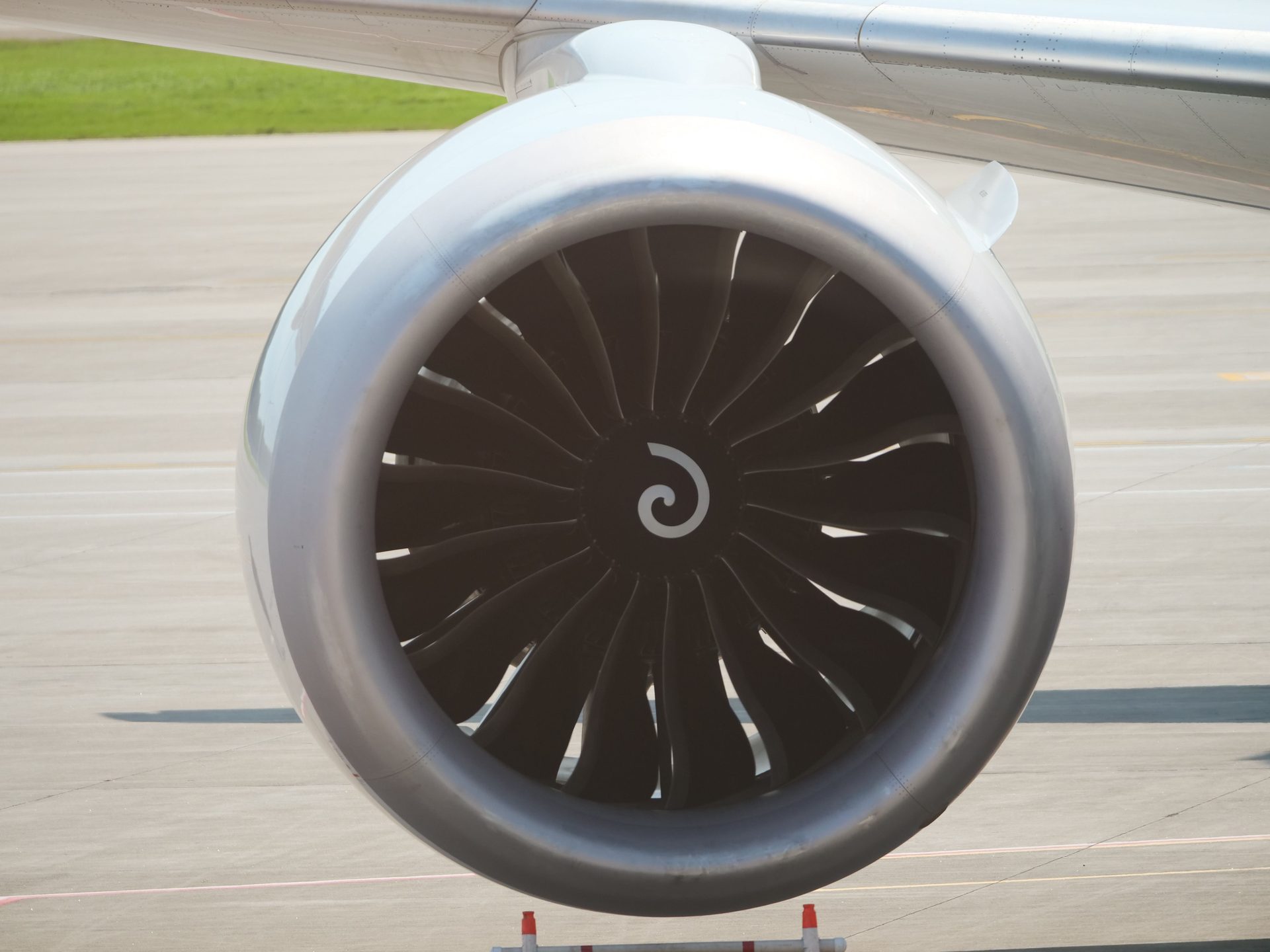 Close-up of a turbofan jet engine on the airport tarmac