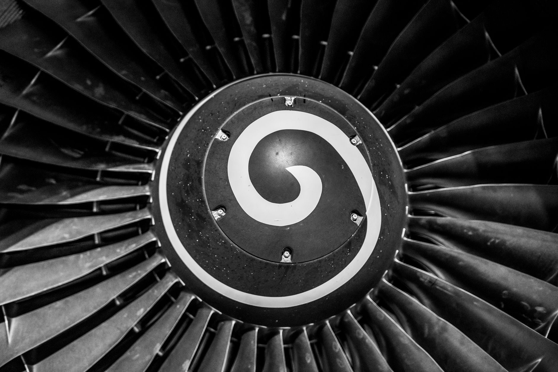 Close-up of a jet engine fan with its characteristic spinner spiral