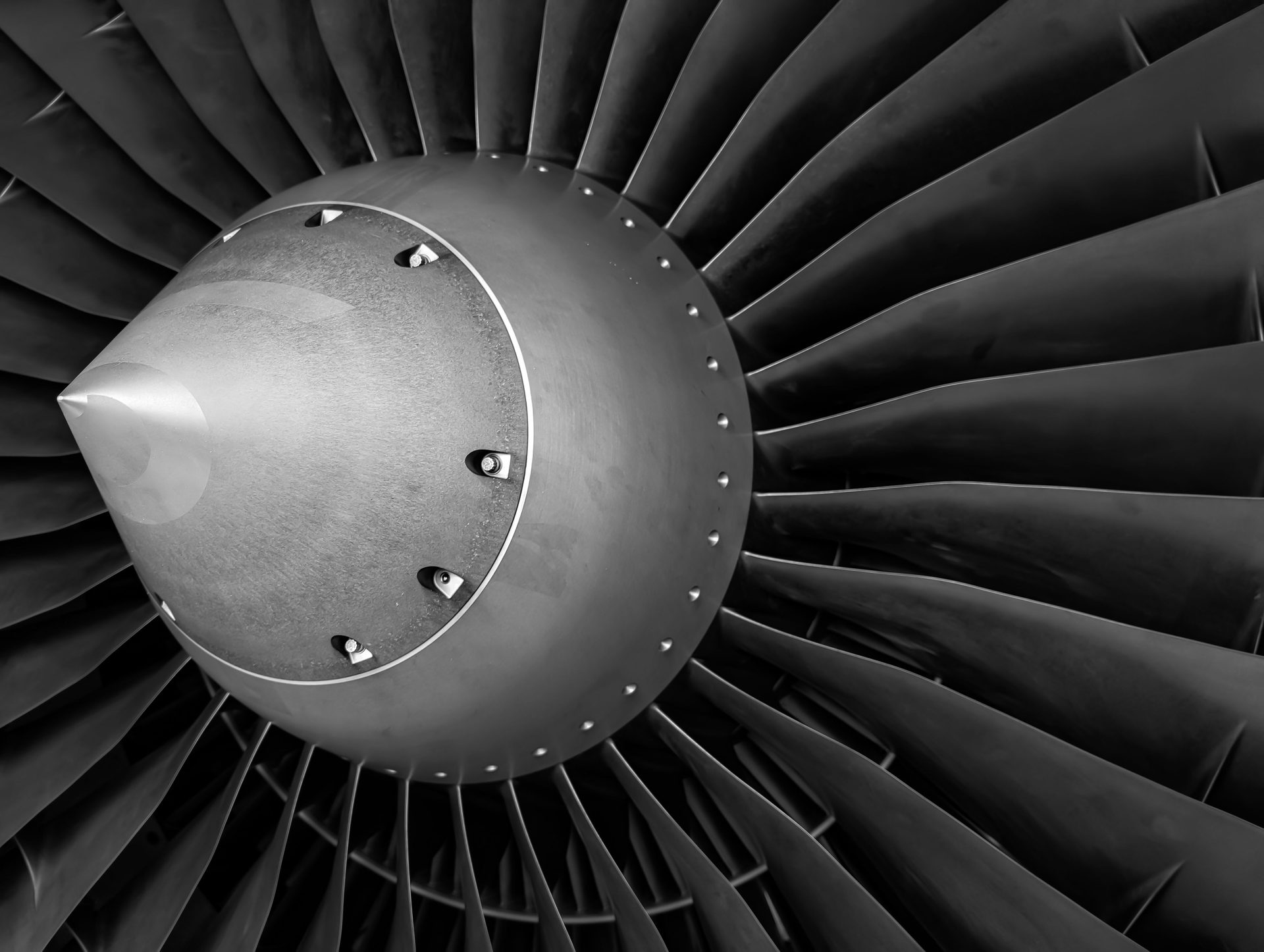 Close-up of a jet engine turbine fan blades during an engine shop inspection